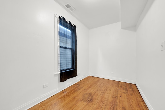 empty room featuring hardwood / wood-style flooring