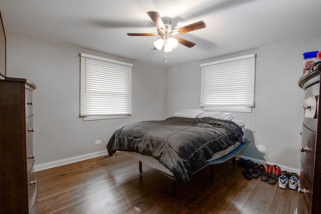 bedroom with ceiling fan and hardwood / wood-style floors