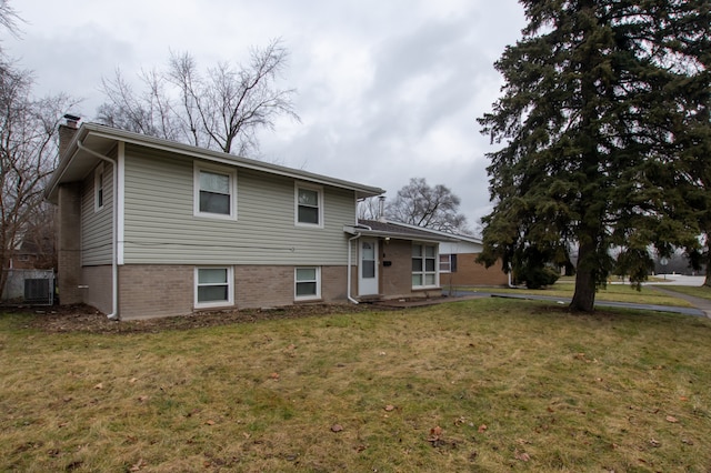 back of house featuring a yard