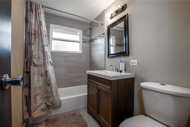 full bathroom featuring shower / bath combination with curtain, toilet, and vanity