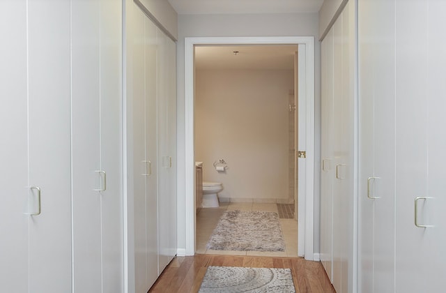 bathroom featuring toilet and hardwood / wood-style floors