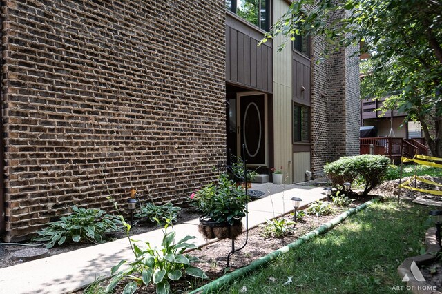 entrance to property with a wooden deck