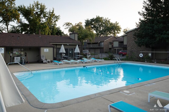 view of swimming pool with a patio