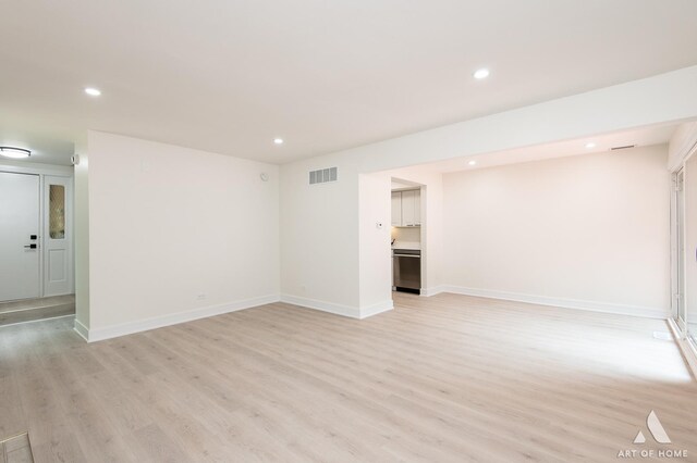 unfurnished living room with light wood-type flooring