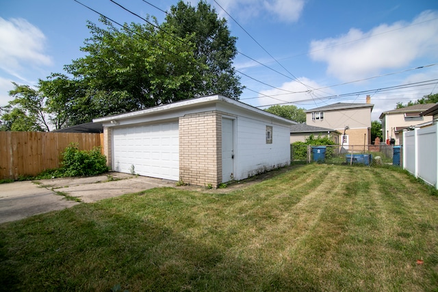 garage with a lawn