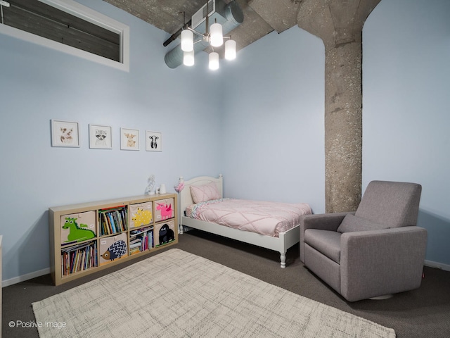 bedroom with dark colored carpet