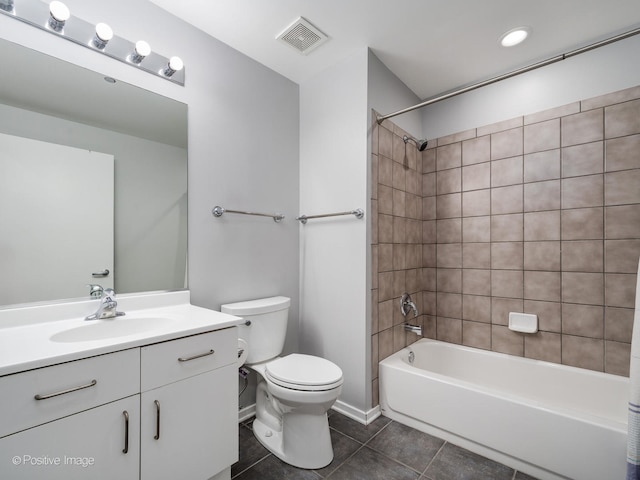 full bathroom featuring visible vents, shower / washtub combination, toilet, tile patterned floors, and vanity