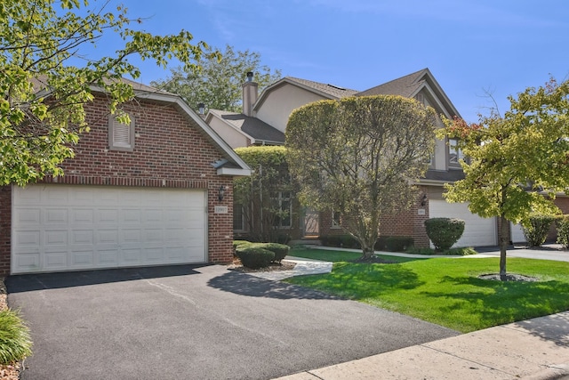 view of front of home featuring a garage and a front yard