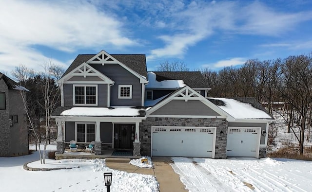 craftsman house featuring covered porch and stone siding