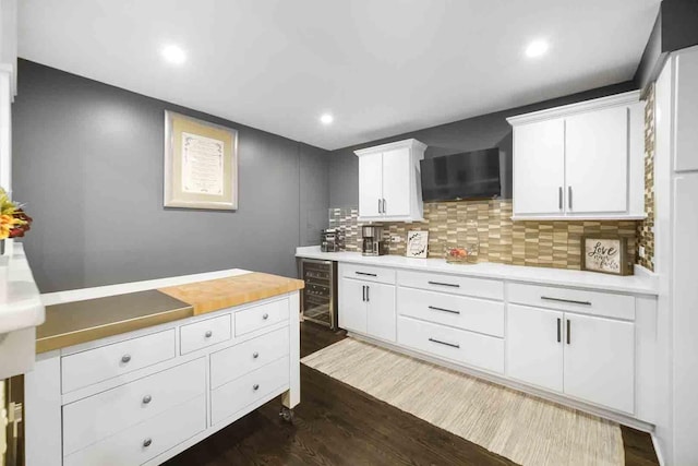 680 N Lake Shore Dr Unit 519, Chicago, IL 60611 - kitchen featuring wine cooler, light countertops, dark wood-style floors, and backsplash