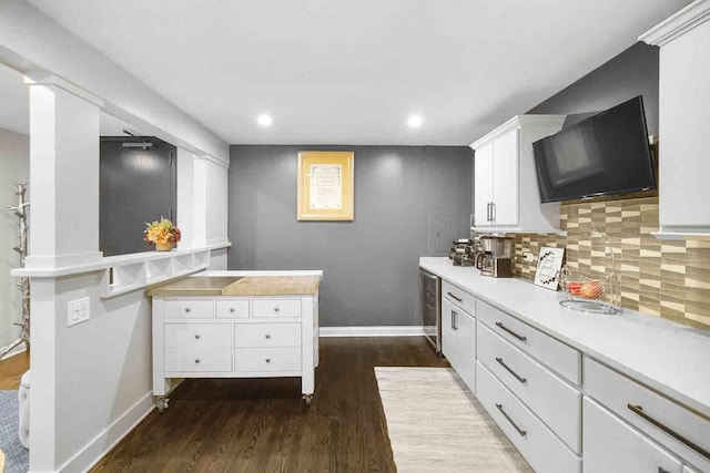 680 N Lake Shore Dr Unit 519, Chicago, IL 60611 - kitchen with dark wood-type flooring, light countertops, white cabinets, and baseboards