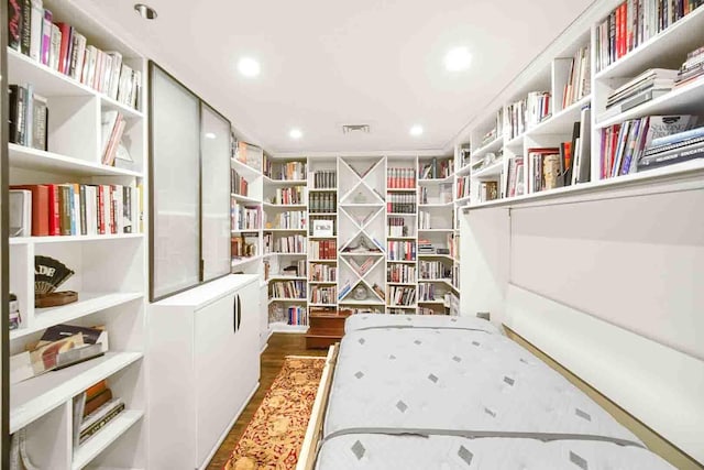 680 N Lake Shore Dr Unit 519, Chicago, IL 60611 - interior space with recessed lighting, wall of books, visible vents, and wood finished floors