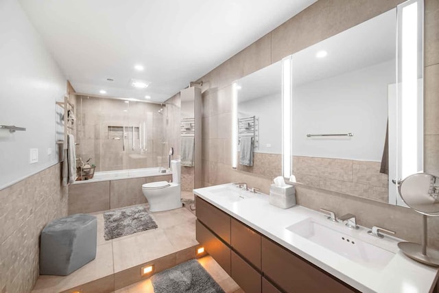 680 N Lake Shore Dr Unit 519, Chicago, IL 60611 - full bath featuring tile walls, a sink, tiled shower / bath, tile patterned floors, and toilet