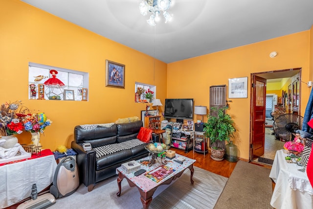 carpeted living room with ceiling fan