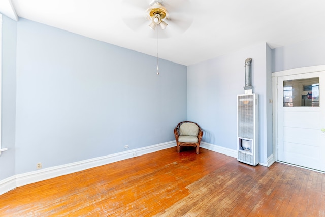 spare room with ceiling fan and hardwood / wood-style flooring