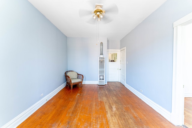 unfurnished bedroom with ceiling fan and hardwood / wood-style floors