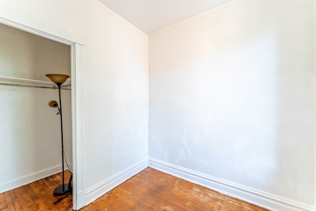 unfurnished bedroom featuring hardwood / wood-style flooring