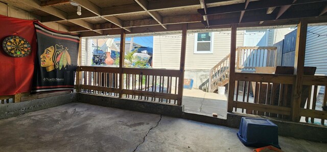 wooden terrace featuring a patio area