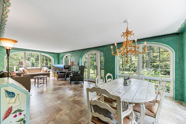 dining room with a notable chandelier and a healthy amount of sunlight