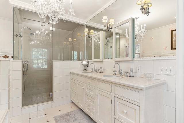 bathroom featuring crown molding, vanity, and walk in shower