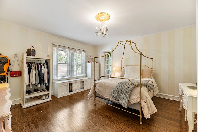 bedroom with dark wood-type flooring, radiator, an inviting chandelier, and ornamental molding