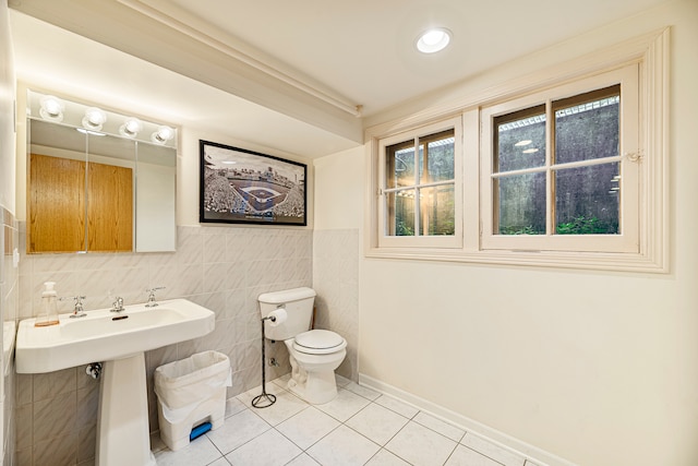 bathroom featuring tile walls, toilet, and tile patterned flooring