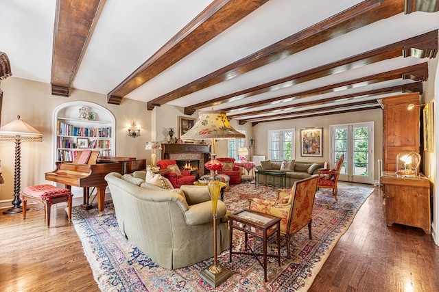 living room featuring dark hardwood / wood-style flooring and beam ceiling