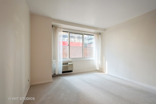 unfurnished room with a wall mounted AC and carpet