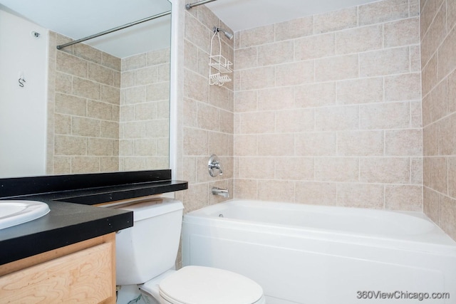 full bath featuring toilet, bathtub / shower combination, and vanity