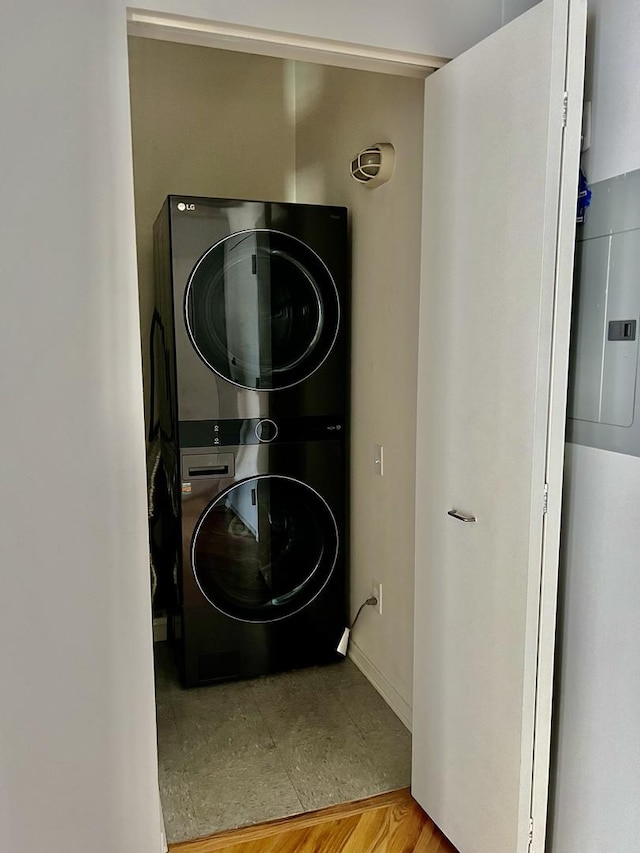 washroom with laundry area and stacked washer and clothes dryer