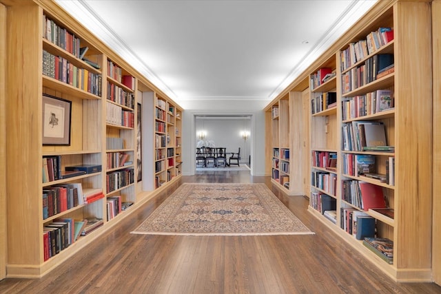 living area featuring crown molding and wood-type flooring