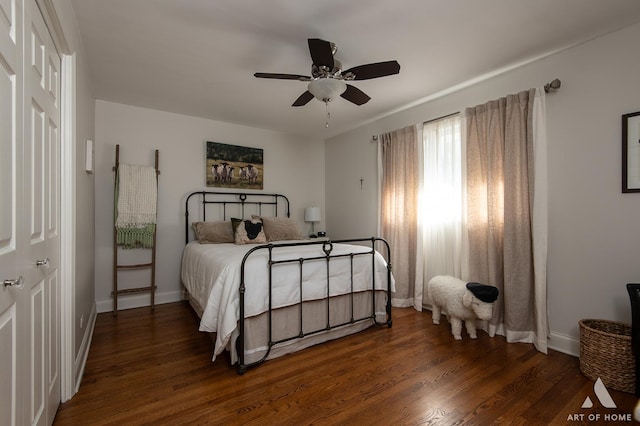 bedroom with dark wood-type flooring and ceiling fan