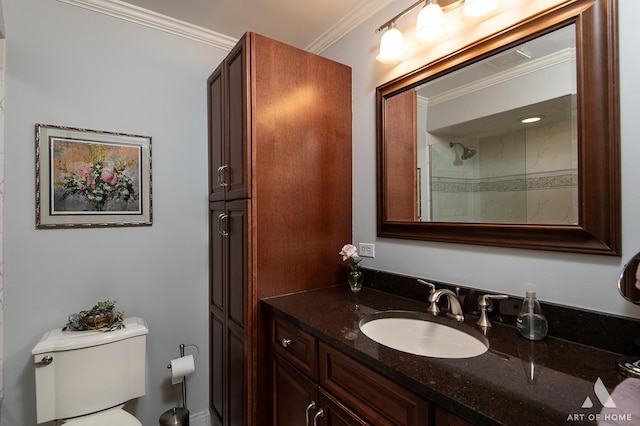 bathroom featuring vanity, crown molding, and toilet