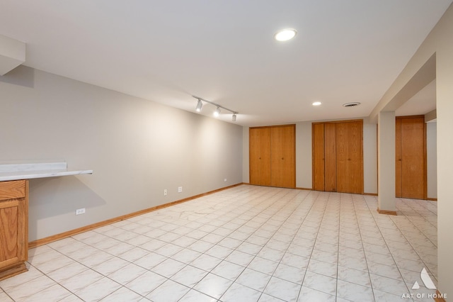 basement with track lighting