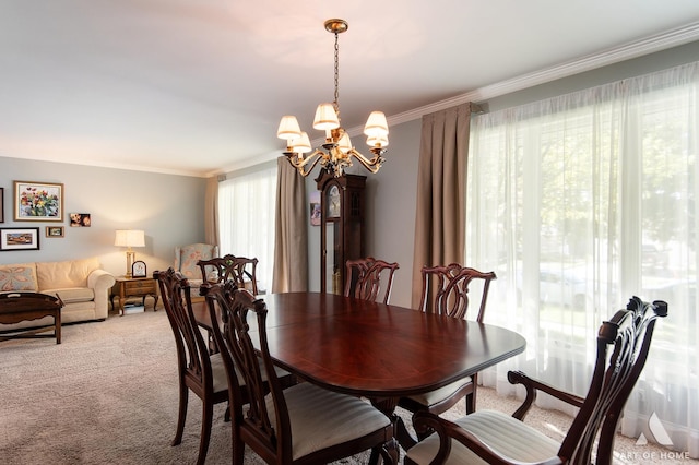 carpeted dining space with an inviting chandelier and ornamental molding