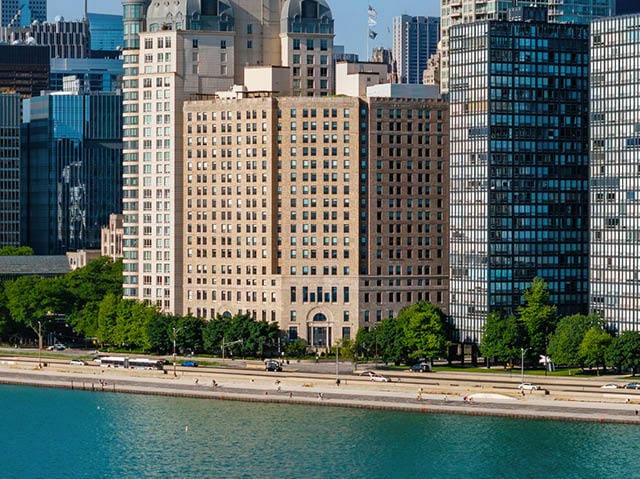 birds eye view of property with a water view and a view of city