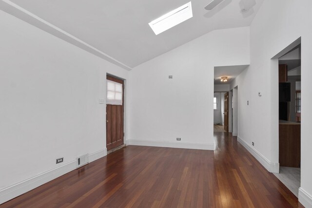 unfurnished room with dark hardwood / wood-style flooring, ceiling fan, and lofted ceiling with skylight