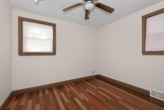 empty room featuring hardwood / wood-style floors and ceiling fan