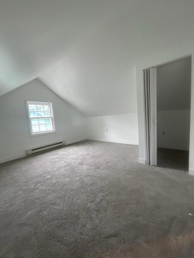 bonus room featuring carpet flooring, baseboard heating, and lofted ceiling