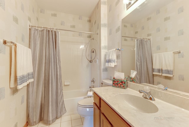 full bathroom with tile patterned flooring, shower / bath combo with shower curtain, vanity, and toilet