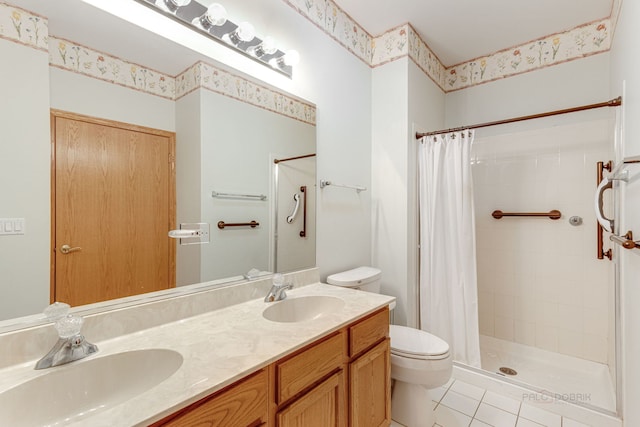 bathroom with tile patterned flooring, toilet, curtained shower, and vanity