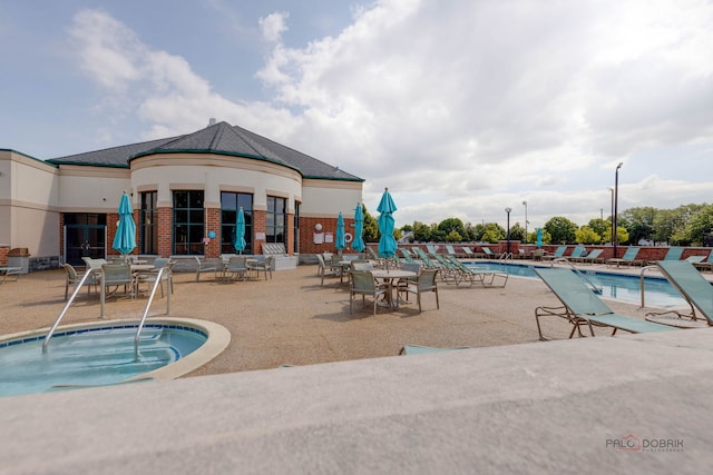 pool featuring a patio and a community hot tub