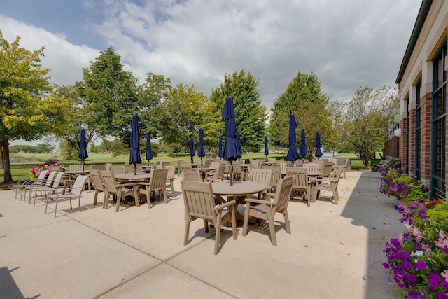 view of patio featuring outdoor dining area