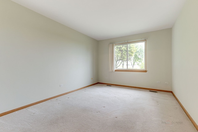 unfurnished room with carpet floors