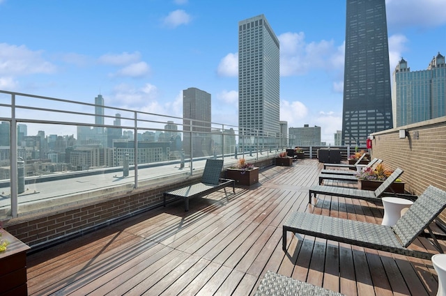 wooden deck with a view of city