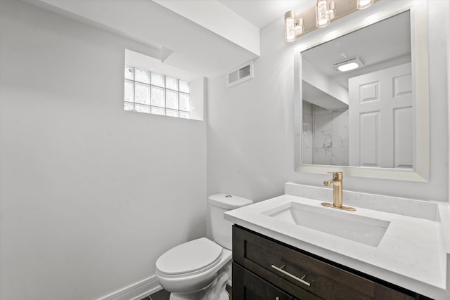 bathroom with toilet and vanity