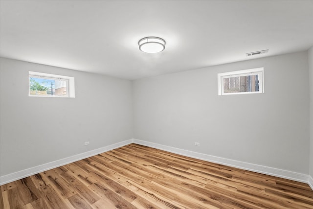 basement featuring hardwood / wood-style floors