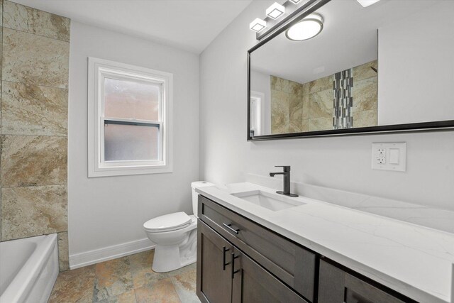 full bathroom featuring tile patterned floors, toilet, tiled shower / bath combo, and vanity