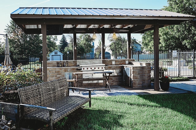 view of home's community with a lawn and a gazebo