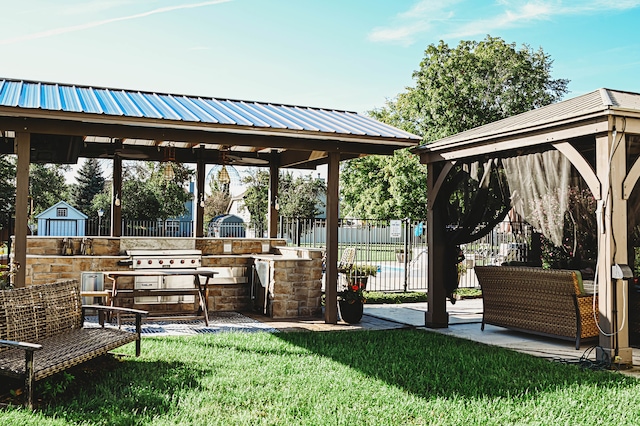 view of property's community with a patio, a yard, and a gazebo